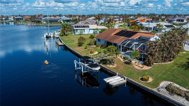 birds eye view of property with a residential view and a water view