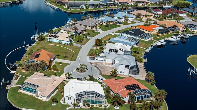 aerial view with a residential view and a water view