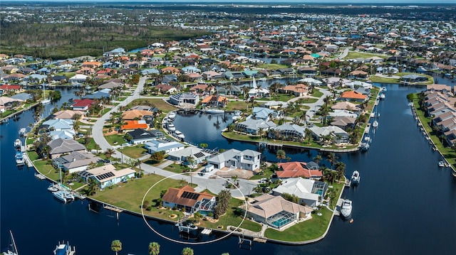 aerial view featuring a residential view and a water view