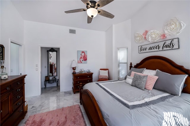 bedroom featuring visible vents, baseboards, marble finish floor, and ceiling fan