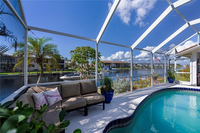 outdoor pool with outdoor lounge area, a lanai, a water view, and a patio