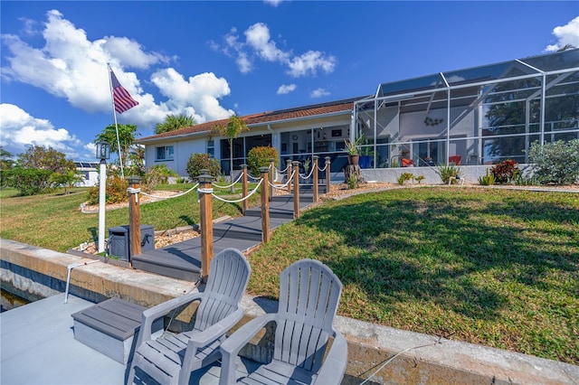 exterior space with a patio area and a lawn