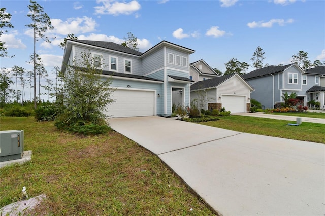 view of front of house featuring a garage and a front yard