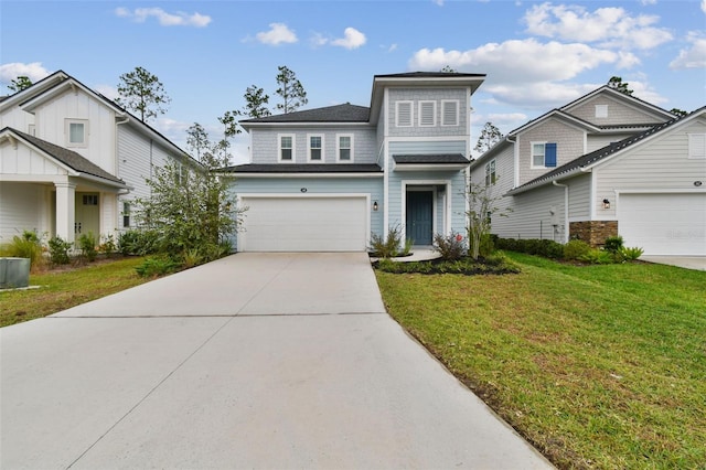 view of front of home with a garage and a front lawn