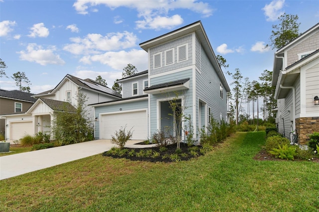 view of front of property featuring a garage, a front yard, and central AC