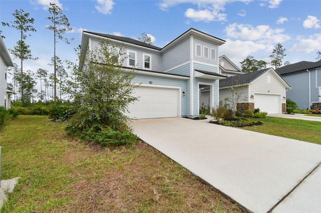 view of front of house featuring a front lawn and a garage