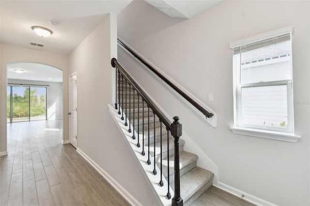 stairs with hardwood / wood-style flooring