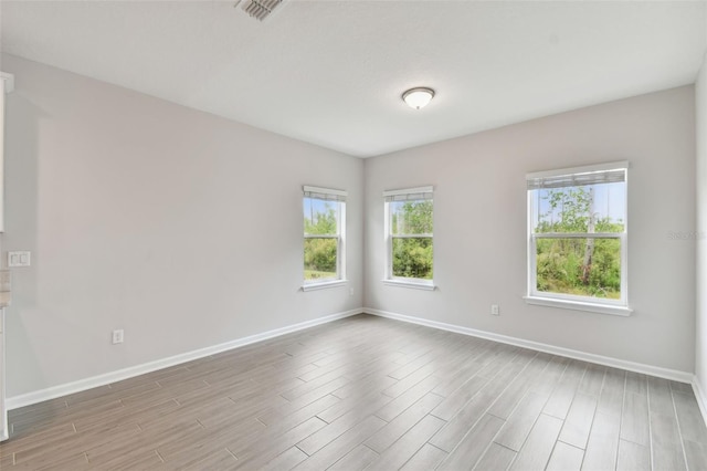 empty room with light wood-type flooring