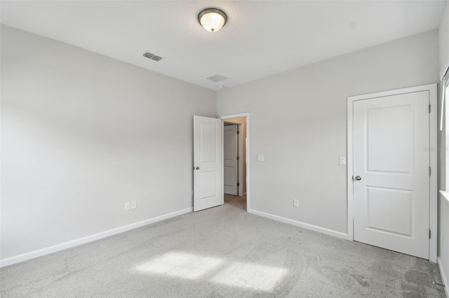 unfurnished bedroom with light carpet