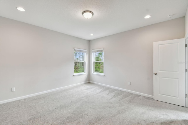 empty room featuring light carpet