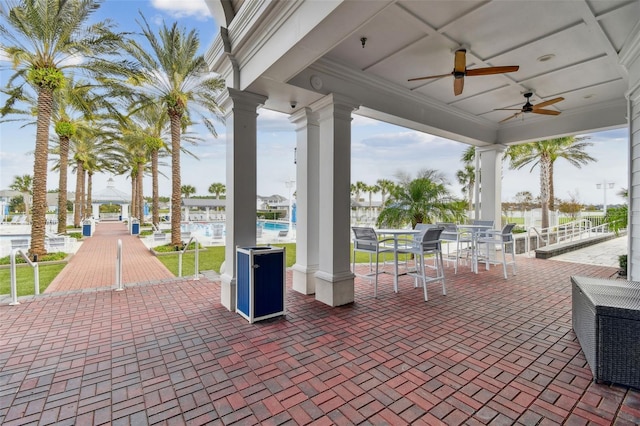 view of patio / terrace featuring ceiling fan and a community pool