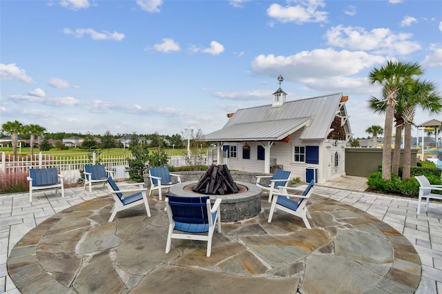 view of patio with a fire pit