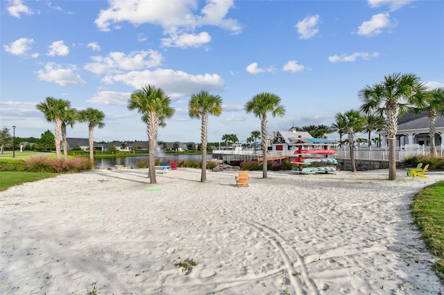 surrounding community featuring a water view