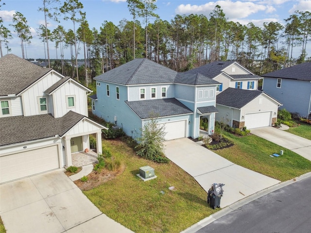 view of front of house with a garage and a front lawn