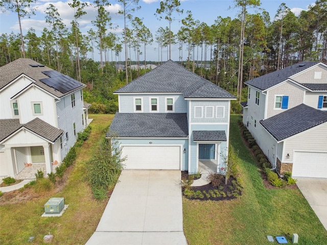 front of property with a garage and a front yard