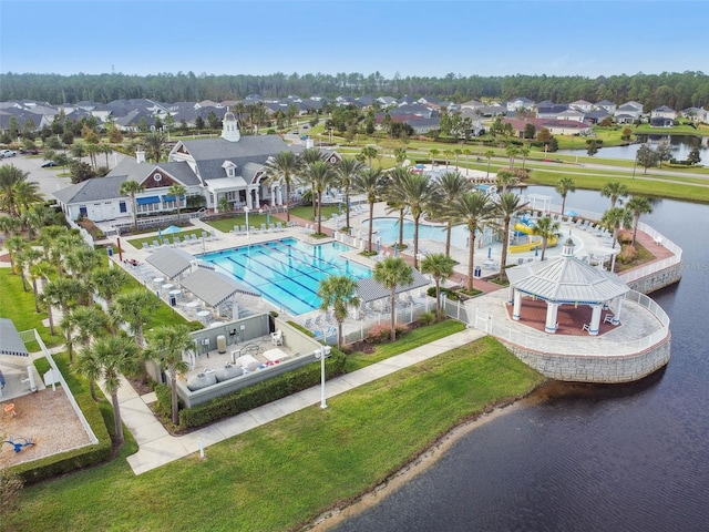 birds eye view of property with a water view