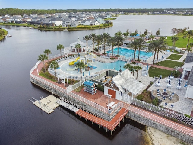 birds eye view of property with a water view