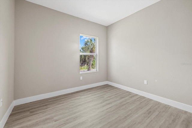 empty room with light hardwood / wood-style floors