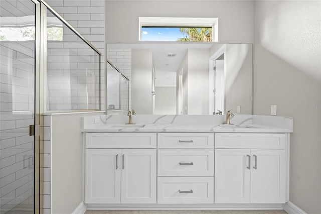 3883 Dominic St, North Port, FL 34288 - bathroom featuring baseboards, a sink, and a stall shower