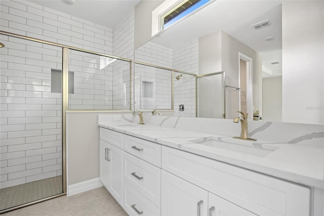 3883 Dominic St, North Port, FL 34288 - bathroom featuring visible vents, a sink, double vanity, and tiled shower
