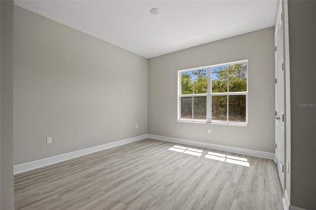3883 Dominic St, North Port, FL 34288 - empty room featuring baseboards and light wood-style flooring
