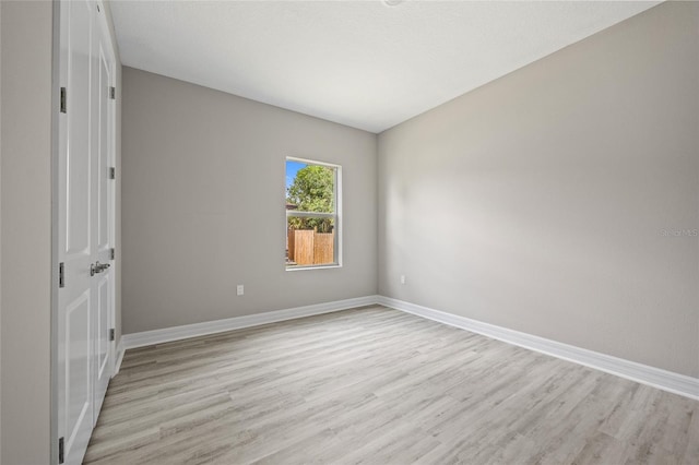 3883 Dominic St, North Port, FL 34288 - unfurnished room with baseboards and light wood-style flooring