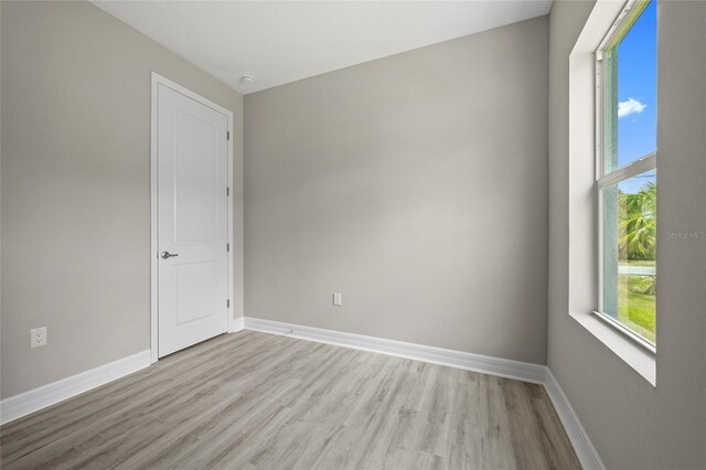 3883 Dominic St, North Port, FL 34288 - unfurnished room with baseboards and light wood-style flooring