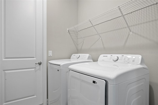 3883 Dominic St, North Port, FL 34288 - clothes washing area featuring separate washer and dryer and laundry area