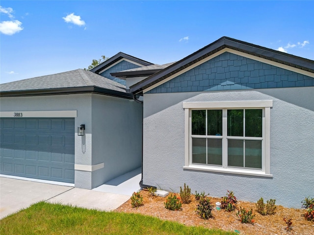 3883 Dominic St, North Port, FL 34288 - ranch-style home with an attached garage, driveway, and stucco siding
