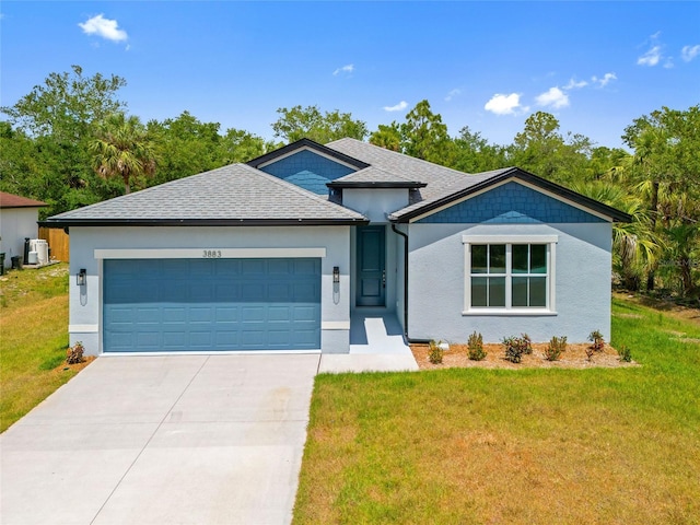 3883 Dominic St, North Port, FL 34288 - ranch-style home with a garage, a front lawn, stucco siding, and driveway
