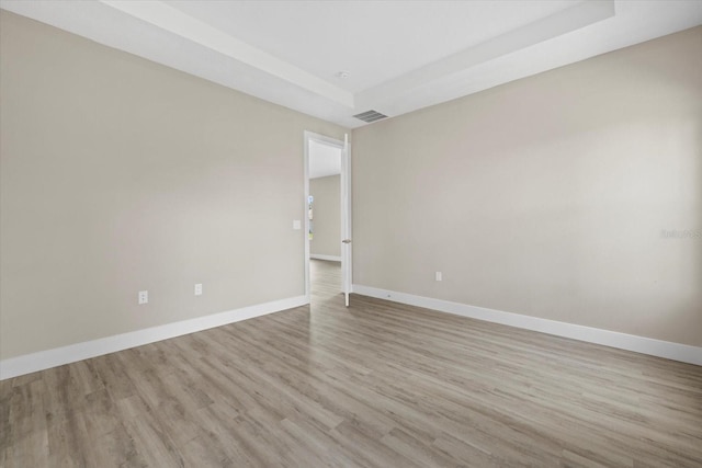 spare room featuring light hardwood / wood-style flooring