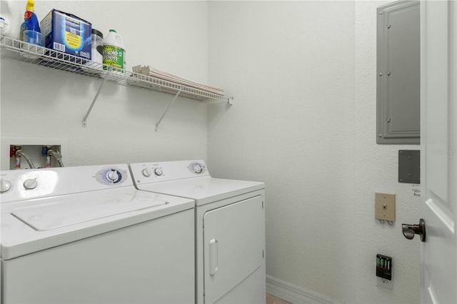 laundry area featuring washing machine and clothes dryer and electric panel