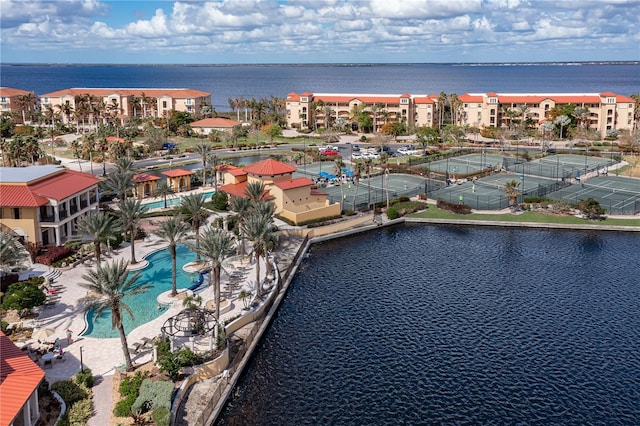 birds eye view of property with a water view