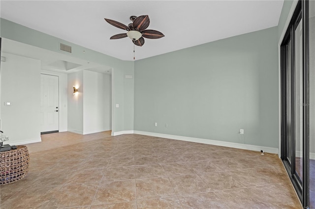 interior space featuring ceiling fan