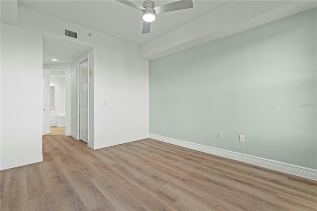 unfurnished room with ceiling fan and light hardwood / wood-style floors