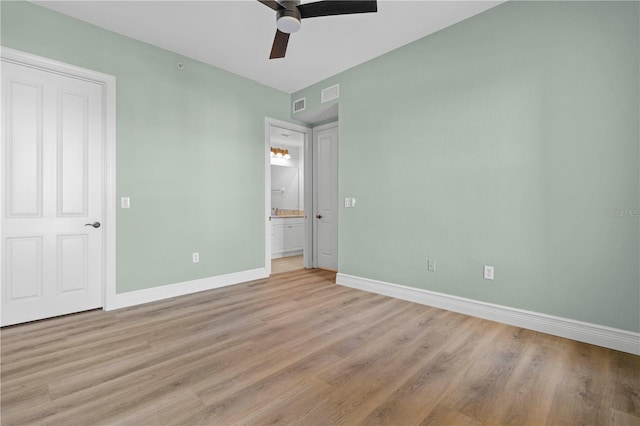 unfurnished bedroom featuring light wood-type flooring and ceiling fan