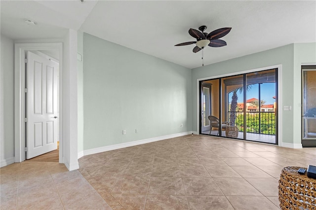 spare room with light tile patterned floors and ceiling fan