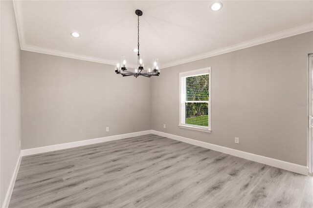 unfurnished room featuring light hardwood / wood-style flooring and crown molding