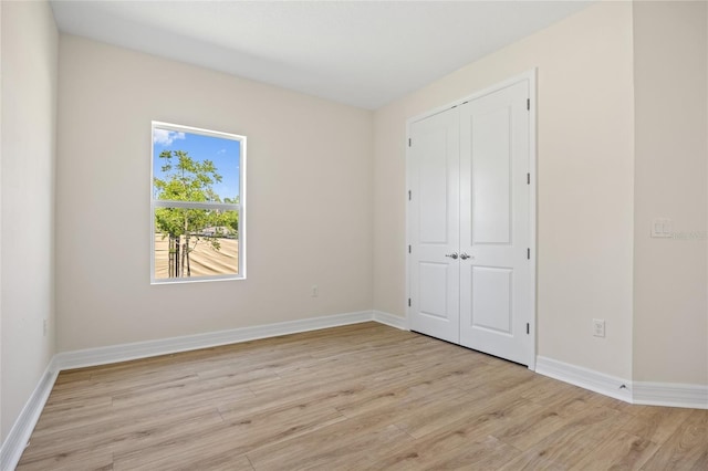 3779 Clearfield St, North Port, FL 34286 - unfurnished bedroom featuring a closet, baseboards, and light wood-type flooring