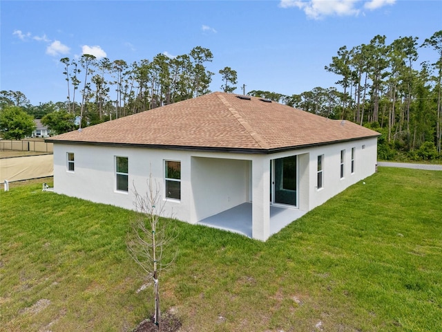 3779 Clearfield St, North Port, FL 34286 - rear view of property with a lawn, a shingled roof, a patio area, and stucco siding