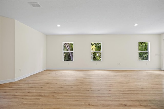 1415 Nackman Rd, North Port, FL 34288 - empty room featuring light wood-style floors, plenty of natural light, recessed lighting, and baseboards
