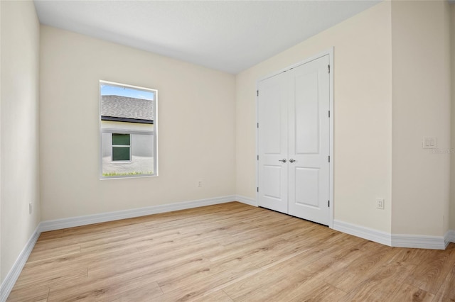 1415 Nackman Rd, North Port, FL 34288 - unfurnished bedroom featuring wood finished floors, baseboards, and a closet