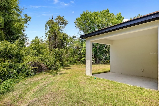 1415 Nackman Rd, North Port, FL 34288 - view of green lawn with a patio area