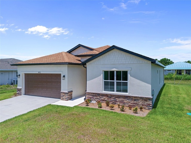 1415 Nackman Rd, North Port, FL 34288 - ranch-style home featuring an attached garage, a front lawn, concrete driveway, stone siding, and stucco siding