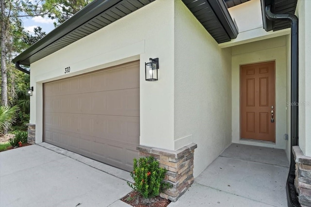 entrance to property featuring a garage