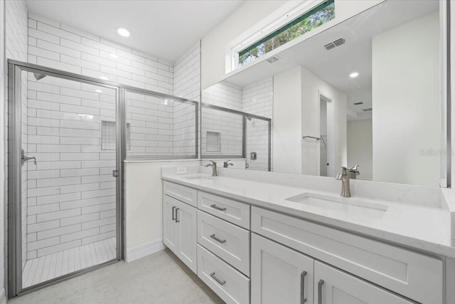 bathroom featuring vanity and a shower with door