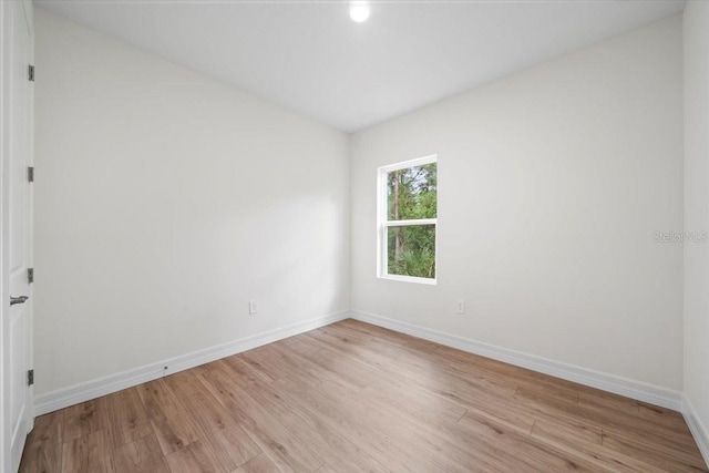 unfurnished room with light hardwood / wood-style floors