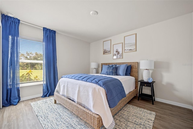 bedroom with hardwood / wood-style floors