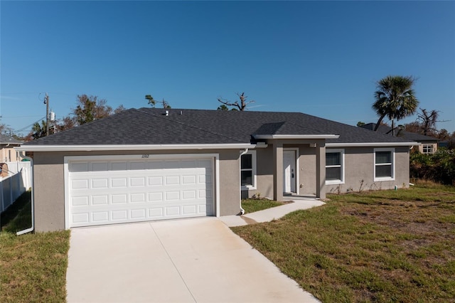 single story home with a front lawn and a garage