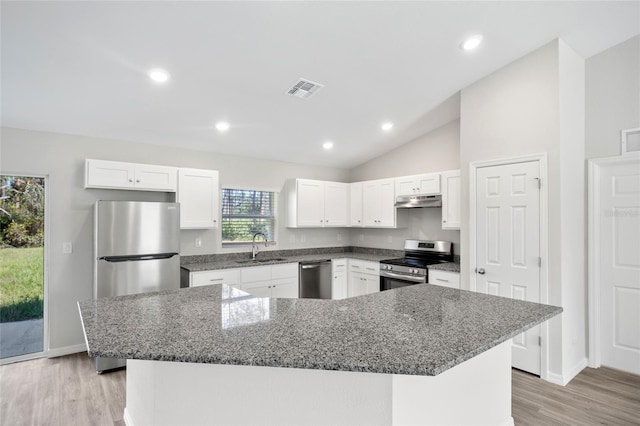 kitchen featuring white cabinets, a kitchen island, and appliances with stainless steel finishes